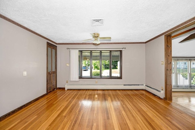 18 Patriot Rd, Tewksbury, MA 01876 - spare room featuring light wood-style flooring, a ceiling fan, a textured ceiling, baseboards, and crown molding