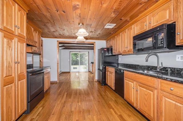 18 Patriot Rd, Tewksbury, MA 01876 - kitchen featuring black appliances, wood ceiling, light wood-style flooring, dark stone counters, and a sink