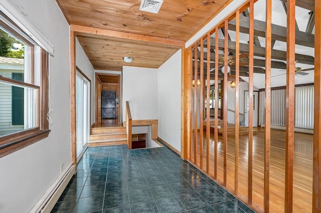 18 Patriot Rd, Tewksbury, MA 01876 - corridor with wooden ceiling, a baseboard radiator, baseboards, and tile patterned flooring