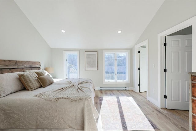 bedroom featuring lofted ceiling, light hardwood / wood-style flooring, and a baseboard radiator