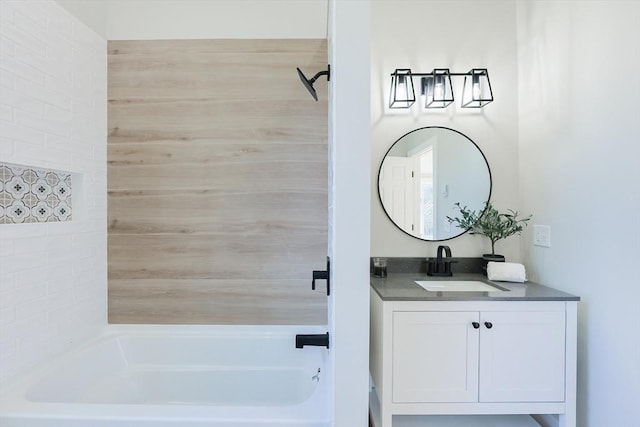 bathroom featuring vanity and tub / shower combination