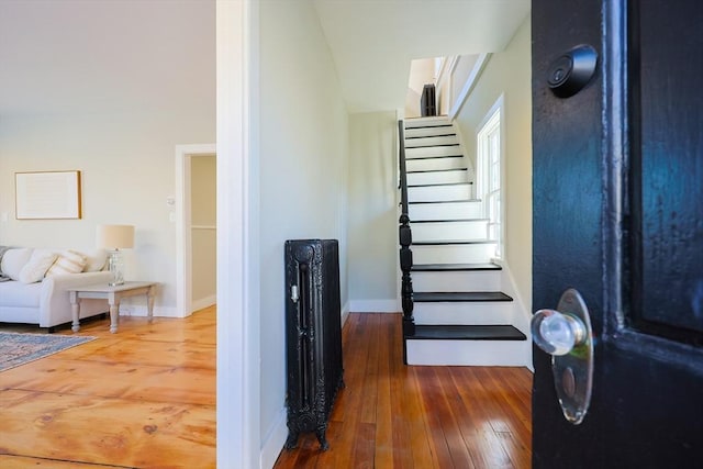 stairway featuring hardwood / wood-style floors