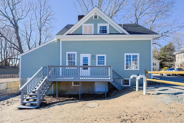 rear view of house with a wooden deck