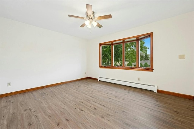 45 Dillon St, Worcester, MA 01604 - empty room with a baseboard radiator, wood finished floors, baseboards, and a ceiling fan