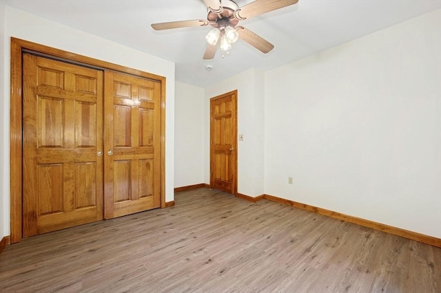45 Dillon St, Worcester, MA 01604 - unfurnished bedroom with baseboards, light wood-style floors, a closet, and a ceiling fan