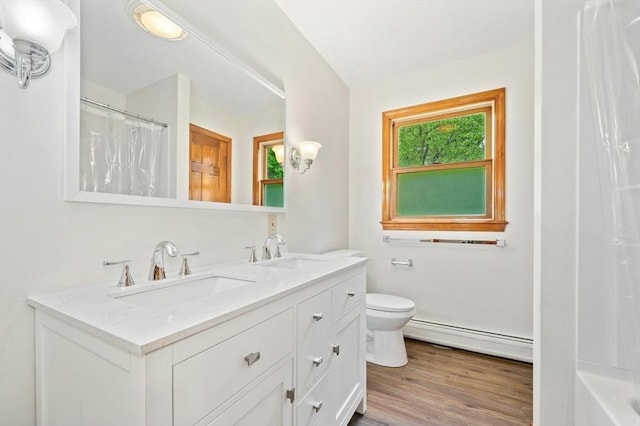 45 Dillon St, Worcester, MA 01604 - bathroom featuring a baseboard heating unit, double vanity, toilet, wood finished floors, and a shower with curtain