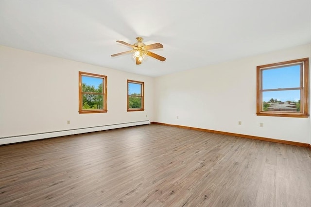 45 Dillon St, Worcester, MA 01604 - unfurnished room with a baseboard radiator, wood finished floors, a ceiling fan, and baseboards