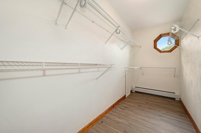 45 Dillon St, Worcester, MA 01604 - spacious closet featuring a baseboard heating unit and wood finished floors