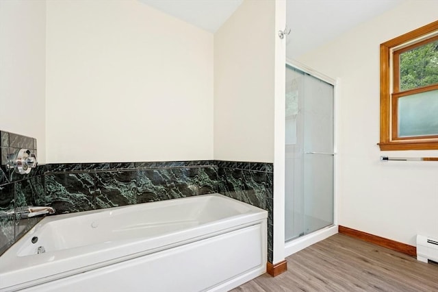45 Dillon St, Worcester, MA 01604 - bathroom with wood finished floors, a bath, baseboards, a stall shower, and baseboard heating