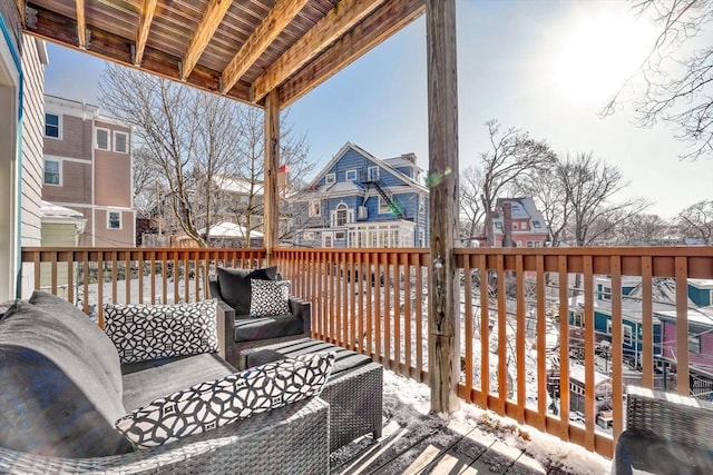 snow covered deck with an outdoor living space