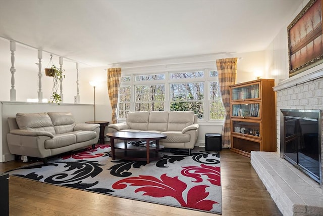 living area featuring wood finished floors and a fireplace