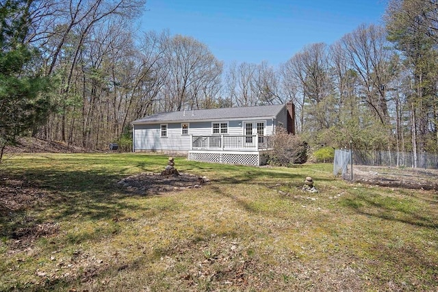 view of front of house with a wooden deck and a chimney