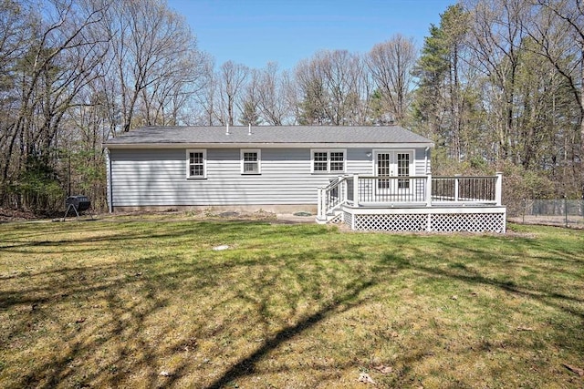 rear view of house with a deck and french doors