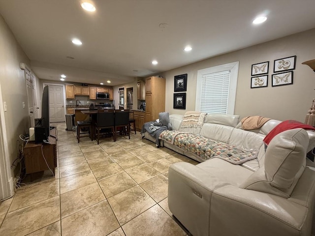 living room featuring light tile patterned floors and recessed lighting