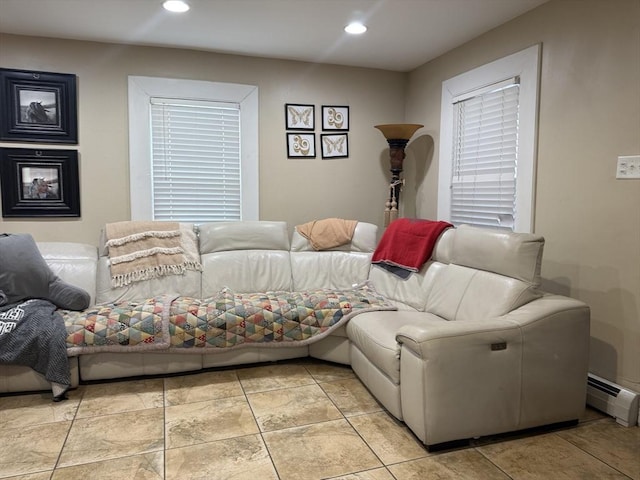 bedroom with a baseboard heating unit and recessed lighting