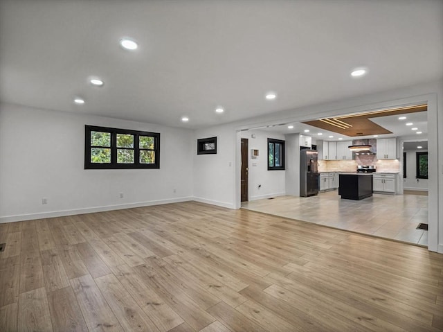 820 N King St, Northampton, MA 01060 - unfurnished living room with recessed lighting and light wood-style flooring