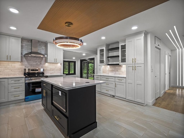 820 N King St, Northampton, MA 01060 - kitchen with wall chimney range hood, stainless steel electric range oven, black microwave, open shelves, and tasteful backsplash