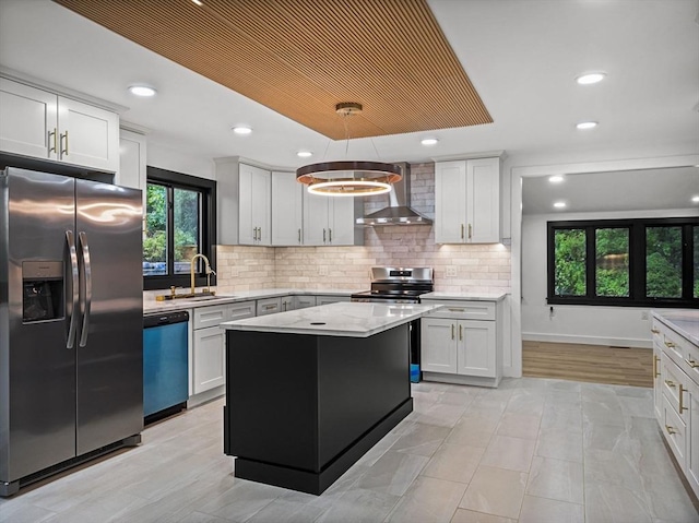 820 N King St, Northampton, MA 01060 - kitchen featuring stainless steel appliances, wall chimney range hood, decorative backsplash, a kitchen island, and recessed lighting