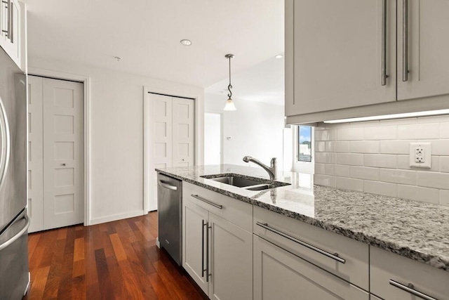 10 Nouvelle Way Unit S703, Natick, MA 01760 - kitchen with a sink, stainless steel appliances, decorative backsplash, dark wood-type flooring, and light stone counters