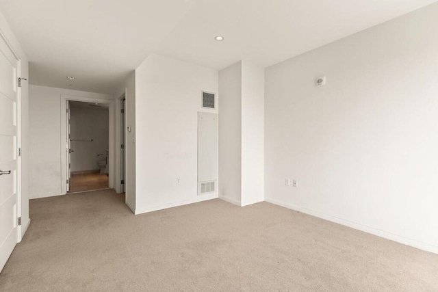 10 Nouvelle Way Unit S703, Natick, MA 01760 - empty room featuring light carpet, recessed lighting, and baseboards