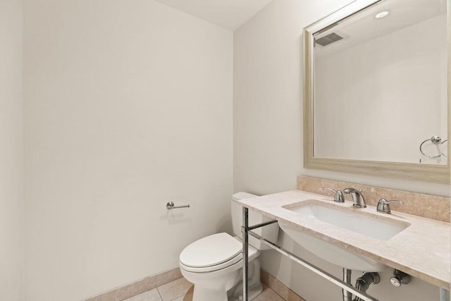 10 Nouvelle Way Unit S703, Natick, MA 01760 - bathroom with a sink, baseboards, toilet, and tile patterned floors