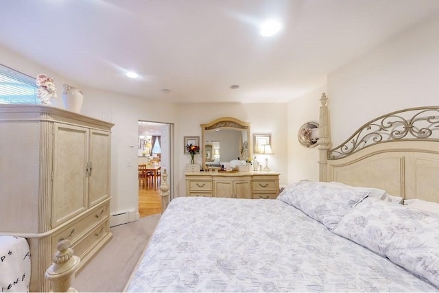 bedroom with baseboard heating and recessed lighting