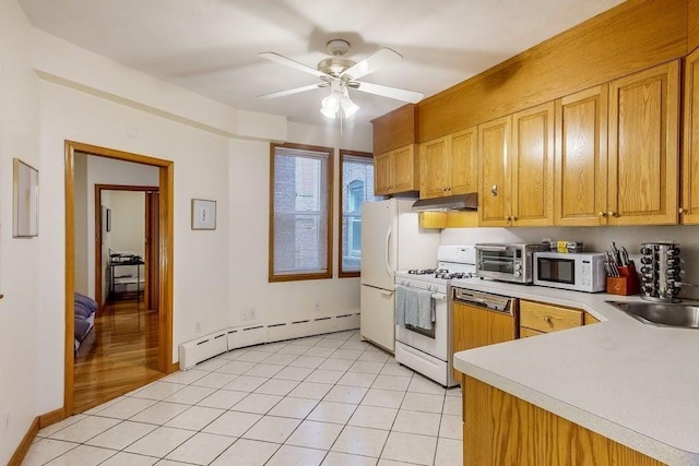 kitchen featuring baseboard heating, under cabinet range hood, white appliances, light countertops, and ceiling fan