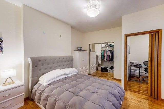 bedroom featuring light wood-style flooring and a closet