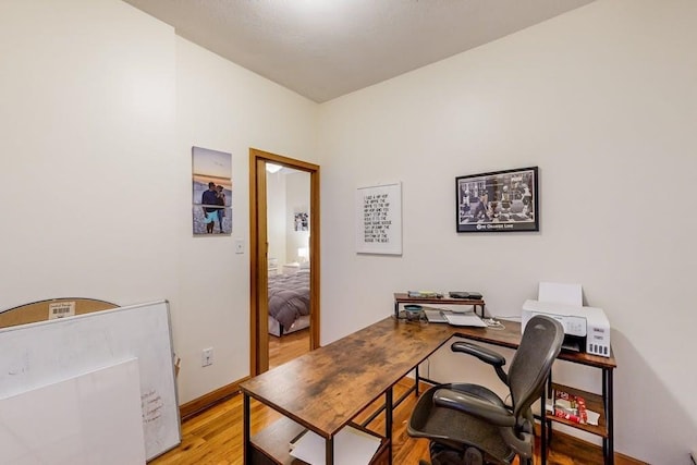 office featuring light wood-style flooring and baseboards
