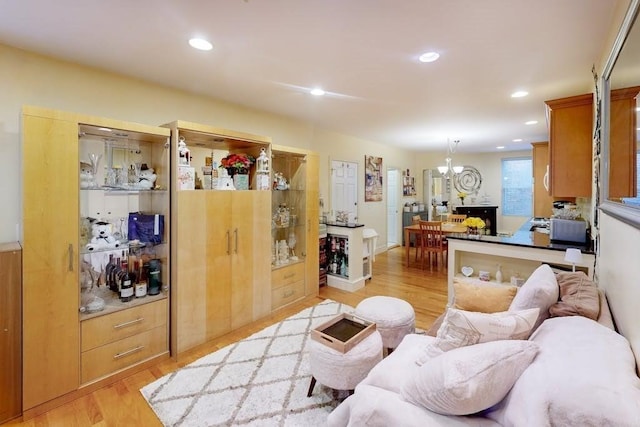 living room featuring light wood-style flooring and recessed lighting