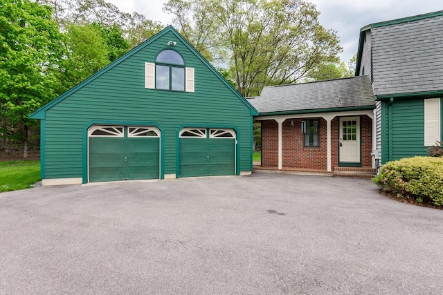 garage with asphalt driveway