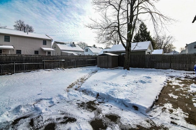 view of yard layered in snow