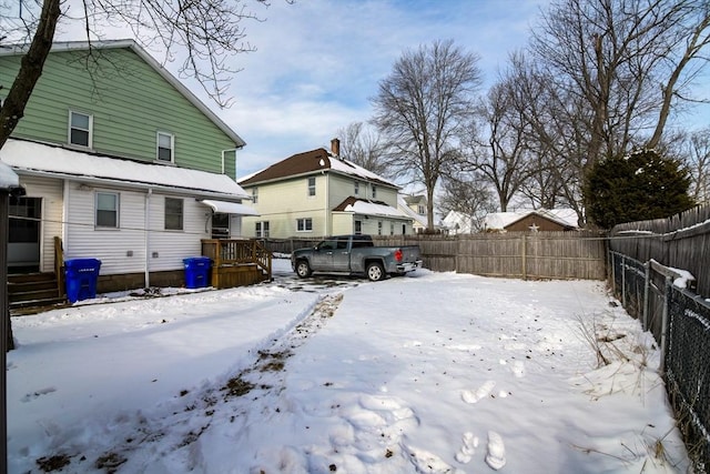 view of yard covered in snow