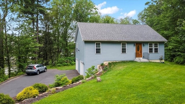 1085 Southbridge Rd, Warren, MA 01585 - view of front facade featuring driveway, a garage, a front yard, and roof with shingles
