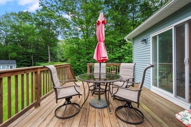 1085 Southbridge Rd, Warren, MA 01585 - wooden terrace with outdoor dining space and an outbuilding