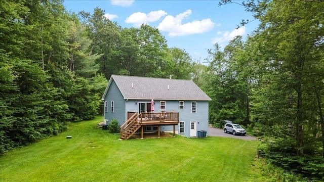 1085 Southbridge Rd, Warren, MA 01585 - back of property with stairway, a deck, a lawn, and a shingled roof
