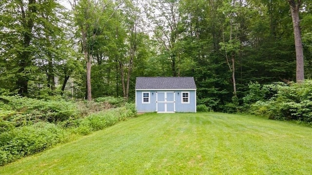 1085 Southbridge Rd, Warren, MA 01585 - view of green lawn featuring a storage unit and a forest view