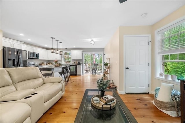 1085 Southbridge Rd, Warren, MA 01585 - living area with light wood finished floors and recessed lighting