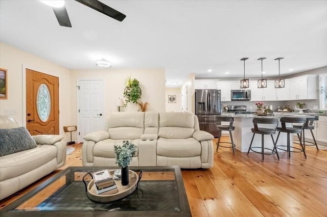 1085 Southbridge Rd, Warren, MA 01585 - living area featuring light wood-style flooring, ceiling fan, and recessed lighting