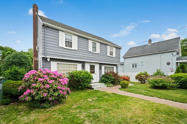 50 Depot St, Milford, MA 01757 - colonial home featuring a chimney and a front lawn