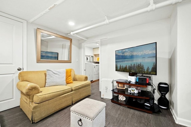 50 Depot St, Milford, MA 01757 - living area with wood finished floors, baseboards, washer / dryer, and recessed lighting