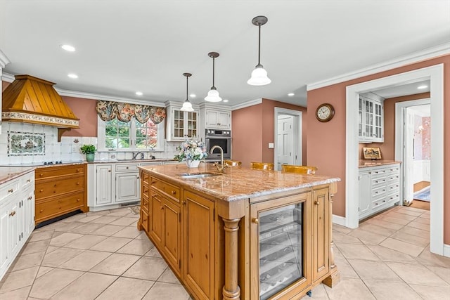 kitchen with wine cooler, a sink, oven, recessed lighting, and tasteful backsplash