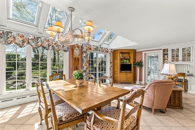 sunroom / solarium featuring a skylight, french doors, vaulted ceiling, and a chandelier