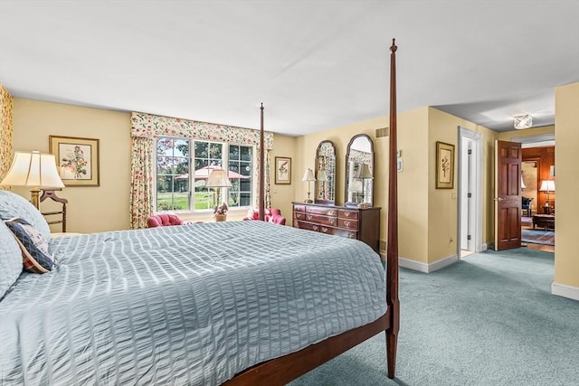 carpeted bedroom with baseboards