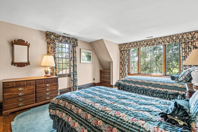 bedroom with wood finished floors