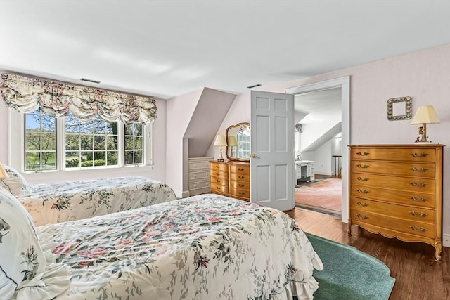bedroom featuring wood finished floors