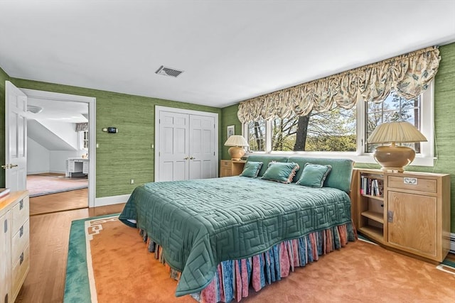 bedroom featuring a closet and wood finished floors