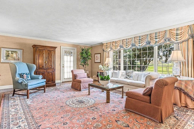 living room with ornamental molding, baseboards, and wood finished floors