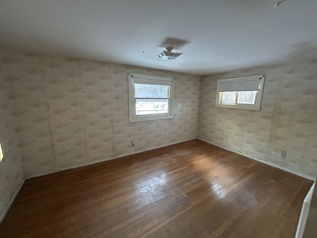 spare room with hardwood / wood-style floors