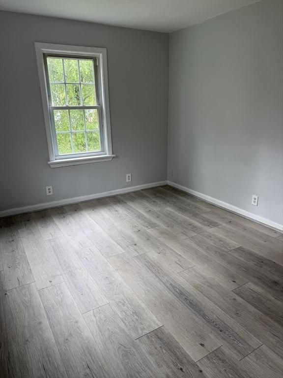 796 Charlton St, Southbridge, MA 01550 - unfurnished room featuring wood finished floors and baseboards